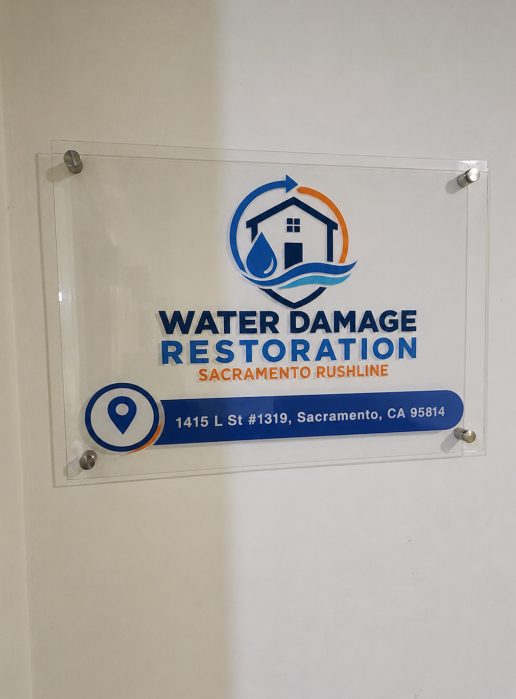 Water Damage Restoration Sacramento Rushline office signage showing the company logo and the address 1415 L St #1319